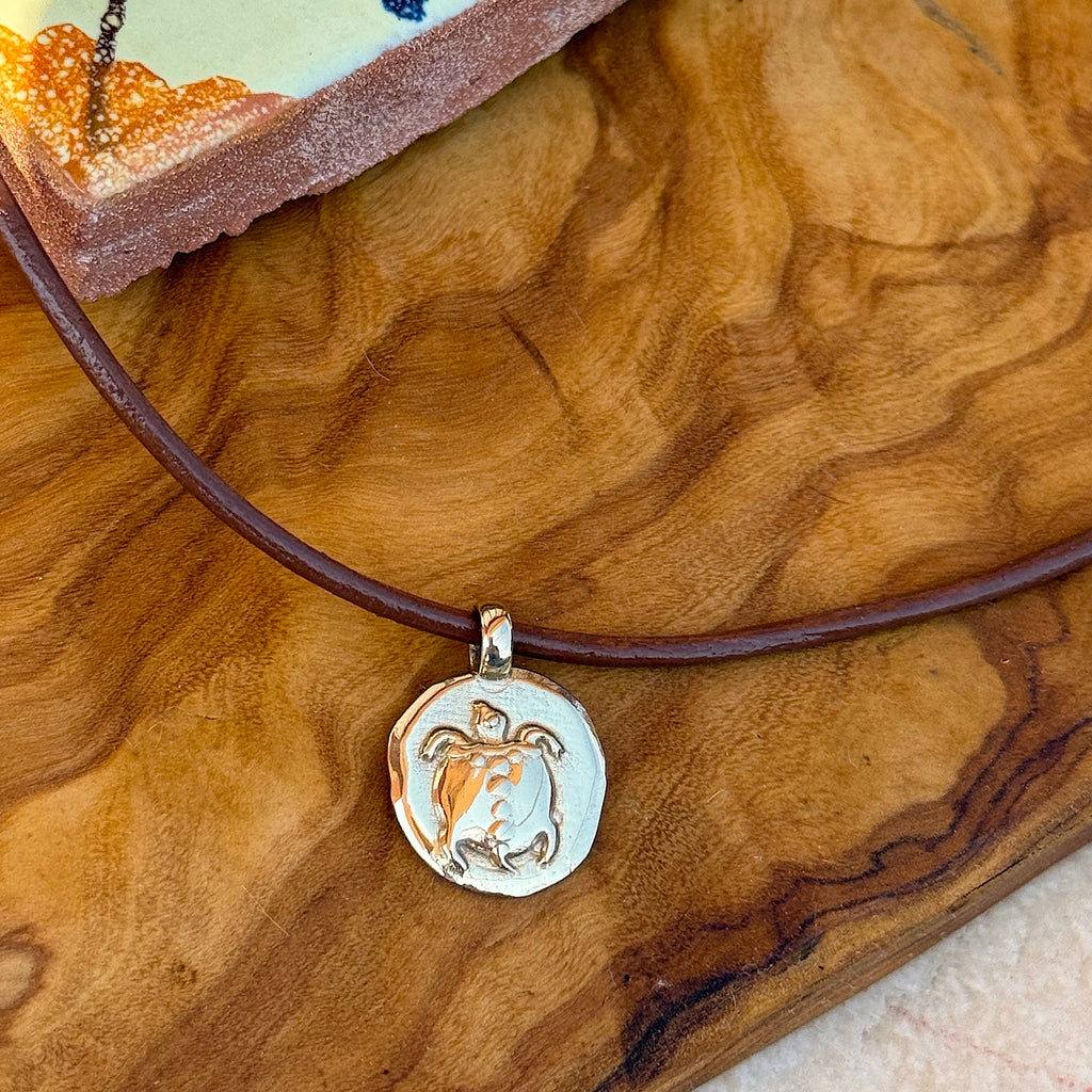 Necklace with a pendant on a wooden surface