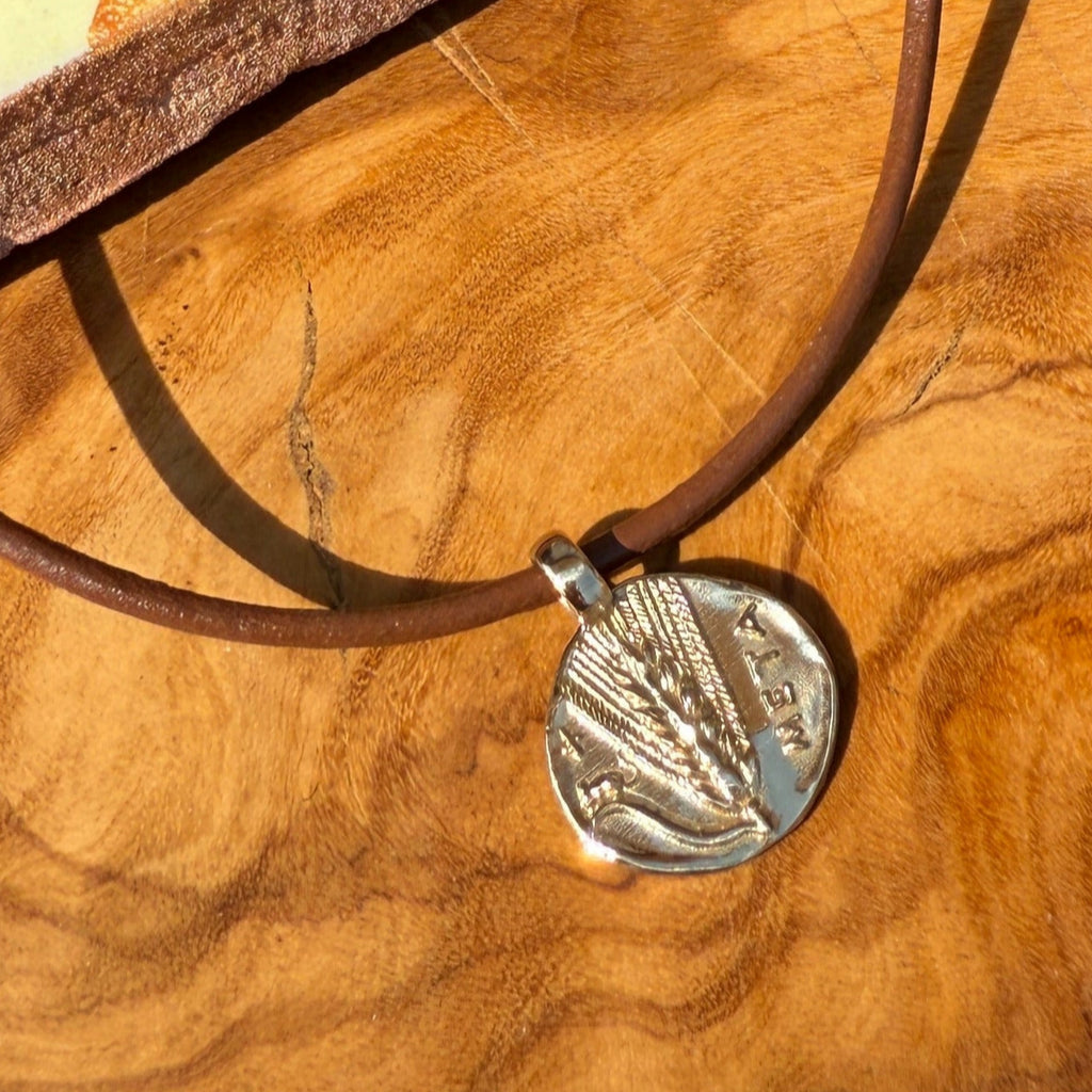 Necklace with a pendant on a wooden surface