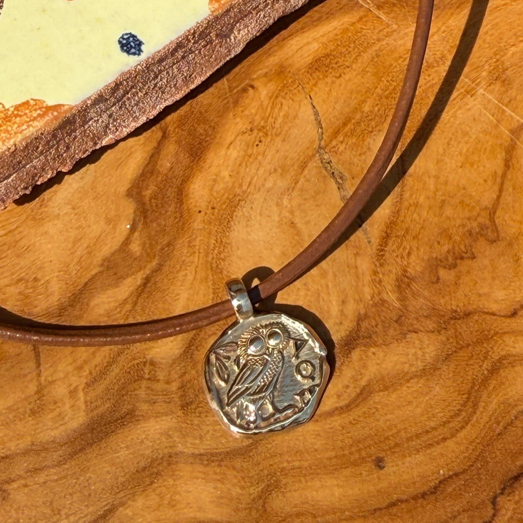 Necklace with a decorative clasp on a wooden surface