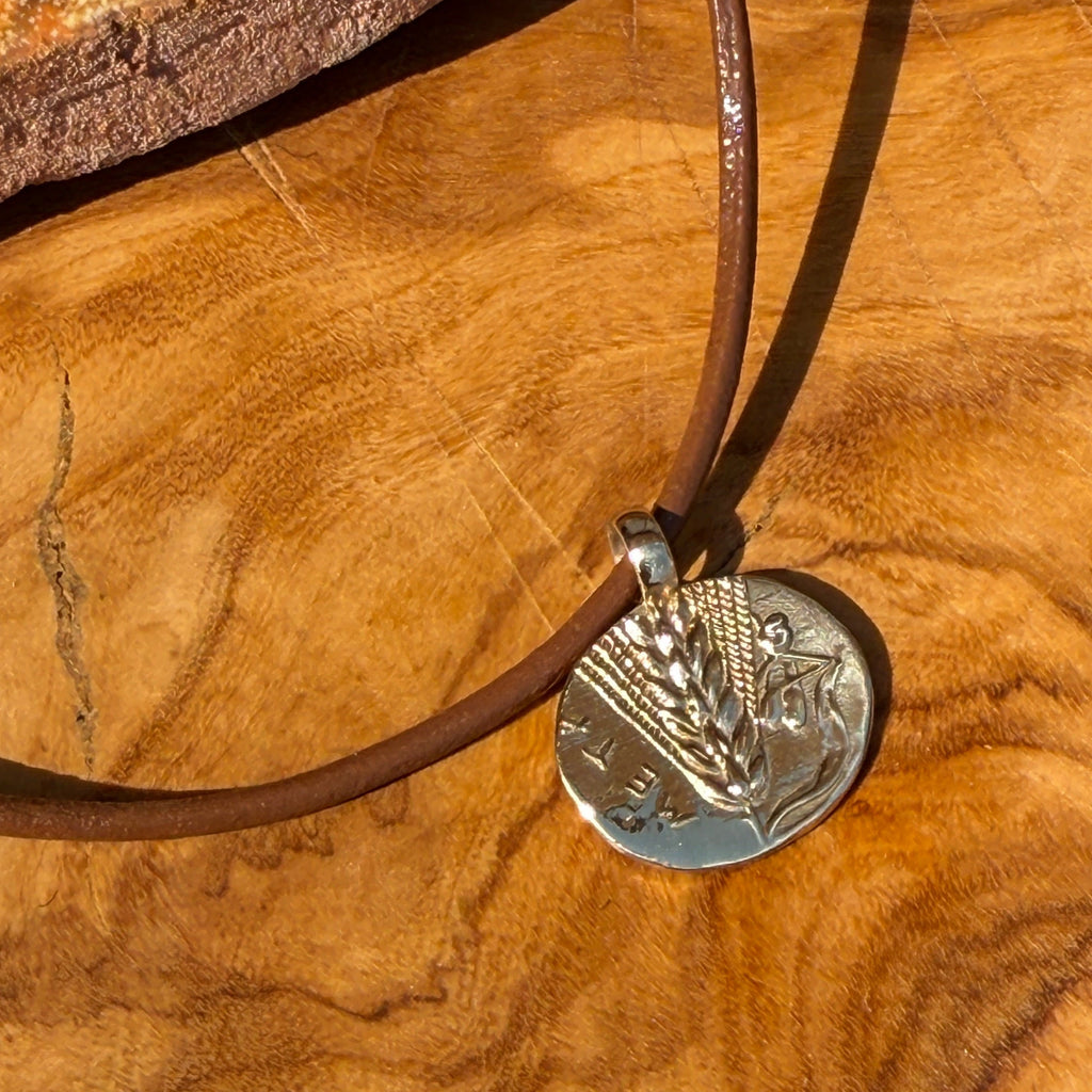 Necklace with a pendant on a wooden surface