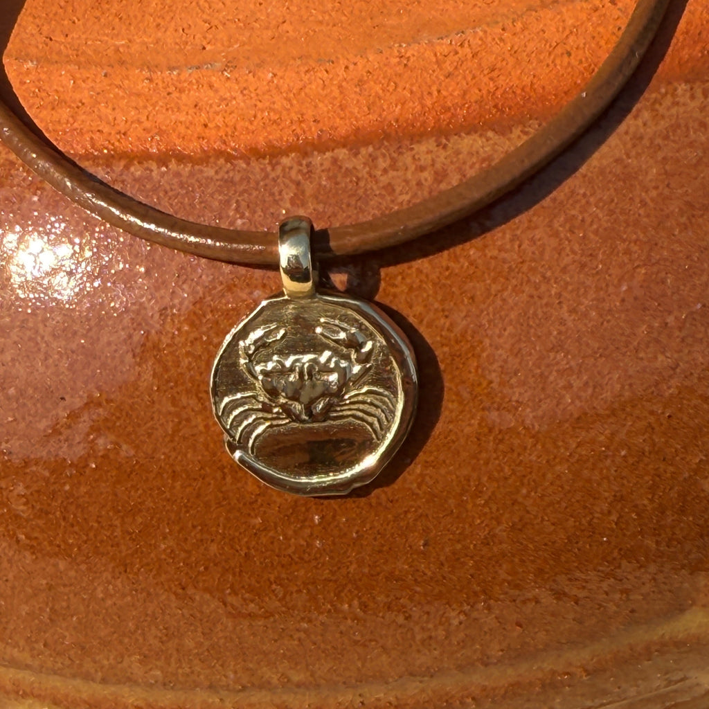 Necklace with a pendant on a wooden surface