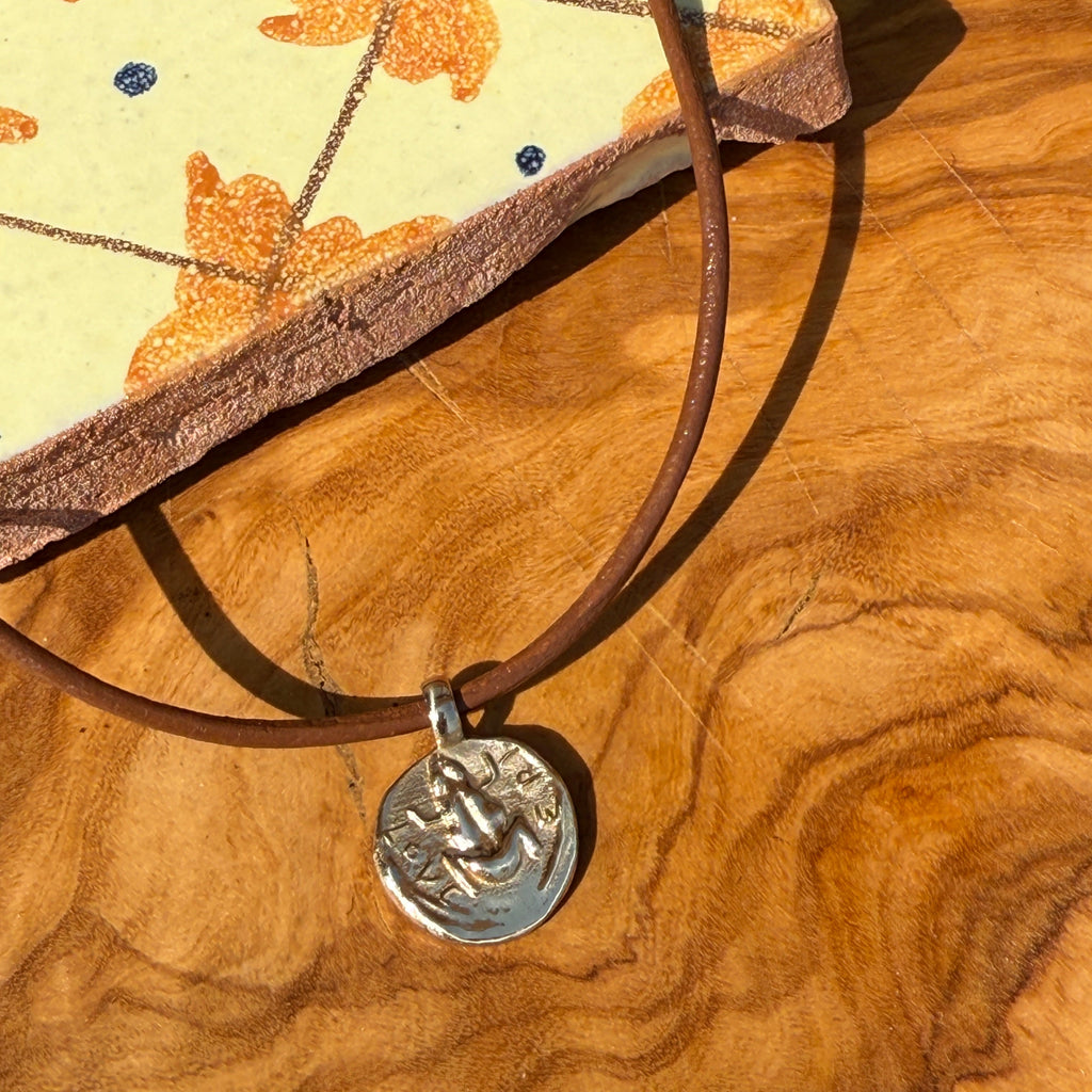 Necklace with a decorative clasp on a wooden surface