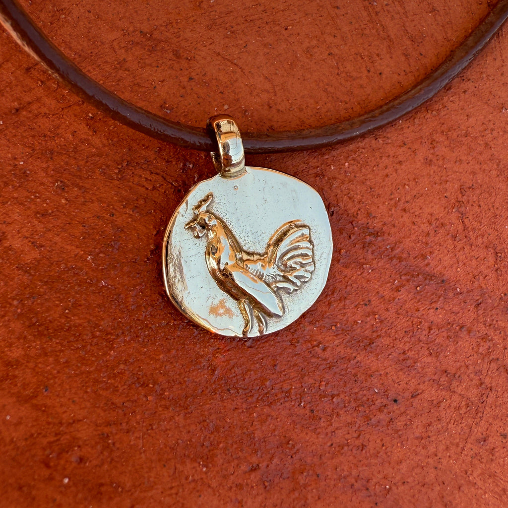 Necklace with a round pendant featuring an animal design on a brown background