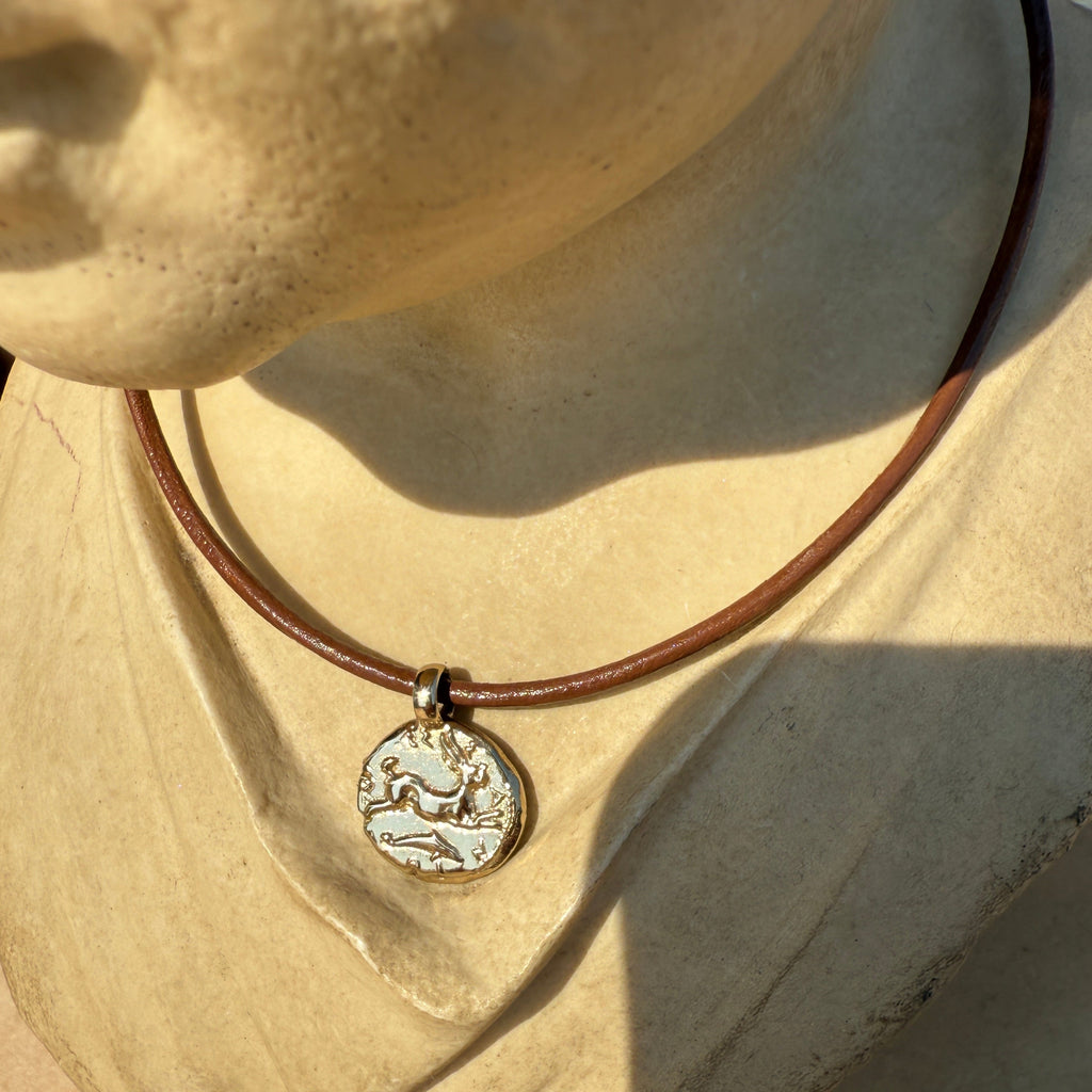 Necklace with a pendant on a textured surface