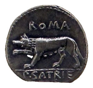 Ancient Roman coin with a wolf and inscription 'Roma' and 'P.Satric', displayed on a black background.
